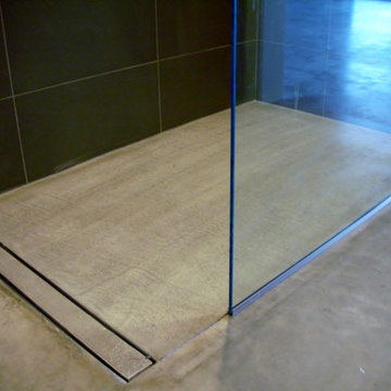 Modern Open Concept Bathroom - featuring a concrete floor and curbless shower