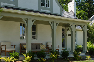 Large elegant beige two-story brick and board and batten exterior home photo in DC Metro with a tile roof and a gray roof