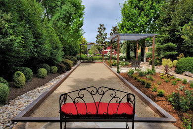 Photo of a mid-sized farmhouse partial sun backyard gravel outdoor basketball/tennis/multi-game court in San Francisco with a pergola for summer.