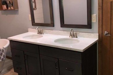 Mid-sized transitional master gray tile and porcelain tile porcelain tile and beige floor bathroom photo in Other with gray walls, an undermount sink, shaker cabinets, dark wood cabinets, quartzite countertops and white countertops
