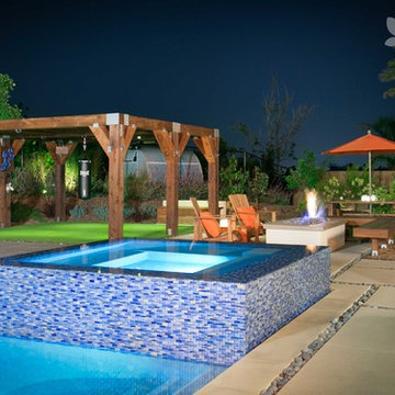Backyard with Pool/Hot Tub, Fire Pit, and Pergola with Punching Bag