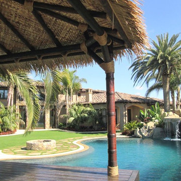 12'x12' Maldives inspired Hut in Synthetic thatch - carved poles in teak stain