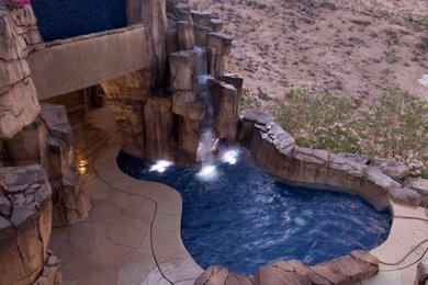 Island style pool photo in Las Vegas