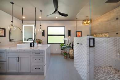 Bathroom - large transitional master brown tile and wood-look tile porcelain tile, gray floor and double-sink bathroom idea in Orange County with shaker cabinets, gray cabinets, a bidet, a vessel sink, quartz countertops, a hinged shower door, white countertops, a niche and a built-in vanity