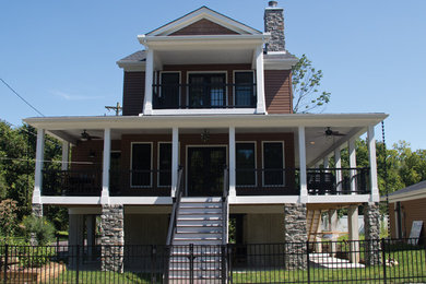 Example of a small beach style brown two-story wood gable roof design in Cincinnati