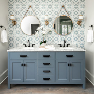 A White Bathroom Accented By Ambrose Blue And White Cement Tile