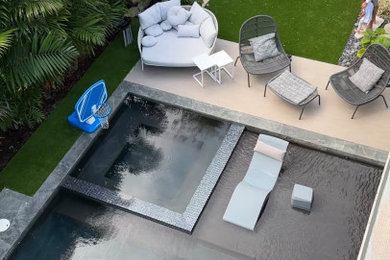 Inspiration for a small modern backyard tile and rectangular lap pool landscaping remodel in Miami