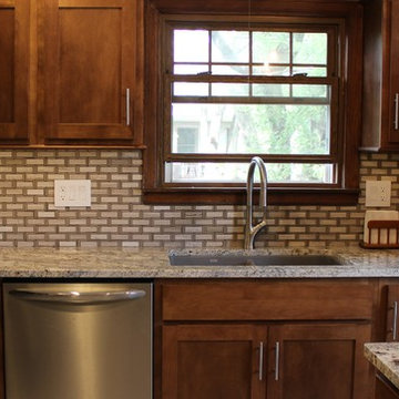 Kitchen With Unique Granite and Small Island in Moline, IL