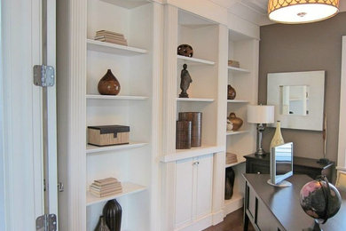 Photo of a large transitional study room in Calgary with brown walls, medium hardwood floors and a freestanding desk.