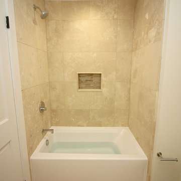 Travertine tile over wedi with glass mosaic in the shower niche