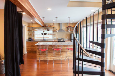 Small trendy single-wall bamboo floor open concept kitchen photo in Portland with an undermount sink, flat-panel cabinets, medium tone wood cabinets, quartzite countertops, metallic backsplash, metal backsplash, stainless steel appliances and an island