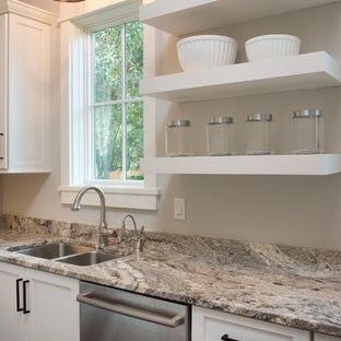 Mid-sized traditional kitchen pantry designs - Mid-sized elegant medium tone wood floor kitchen pantry photo in Atlanta with an undermount sink, recessed-panel cabinets, white cabinets and stainless steel appliances