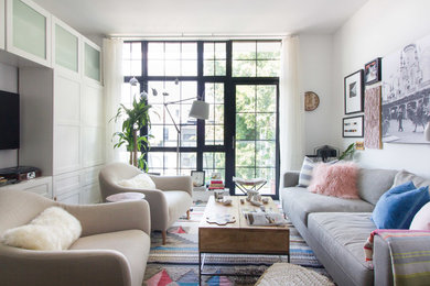 Inspiration for a small contemporary open concept living room in New York with white walls and no fireplace.