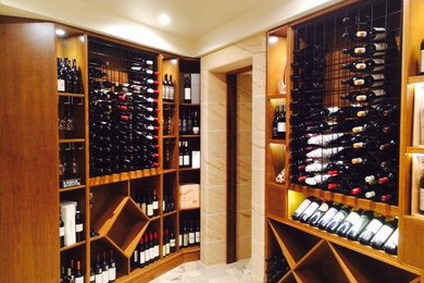 This is an example of an eclectic wine cellar in Sydney.