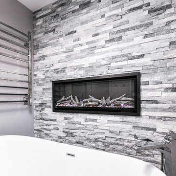 Striking Master Ensuite Featuring a Built-In Electric Fireplace