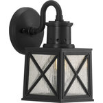 Progress Lighting - Seagrove Collection 1-Light Small Wall Lantern with DURASHIELD - Capture the raw strength and captivating honesty of salty seashores with this coastal-inspired wall lantern. Clear seeded glass panes rest in a non-metallic, corrosion-resistant composite polymer with a rich black finish. An x-brace design adorns each side of the frame and adds an extra pinch of rustic character. DURASHIELD by Progress Lighting is built to last. Constructed from a composite material with UV protection, DURASHIELD holds up even in the harshest weather conditions. This high-performance finish has a 5-year warranty and is resistant to rust, corrosion, and fading.