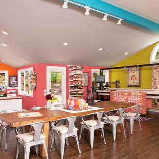 Design ideas for a large traditional craft room in Seattle with multi-coloured walls, dark hardwood floors and a built-in desk.
