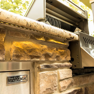 Screen Room Addition with Retractable Screens, Outdoor Kitchen, and Patio