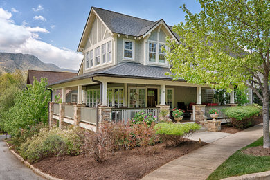 Inspiration for a large craftsman beige two-story wood exterior home remodel in Other