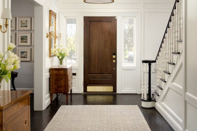 Mid-sized transitional dark wood floor and brown floor entryway photo in DC Metro with white walls and a dark wood front door
