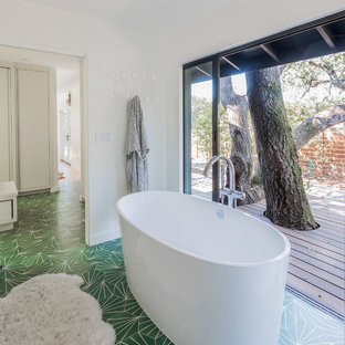 Inspiration for a 1950s master cement tile floor and green floor freestanding bathtub remodel in San Francisco with white walls