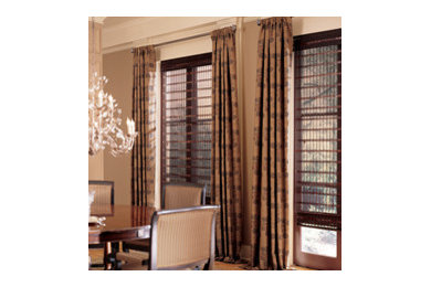 Mid-sized elegant light wood floor enclosed dining room photo in Other with beige walls and no fireplace