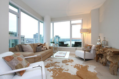 Inspiration for a small contemporary light wood floor living room remodel in Vancouver with gray walls