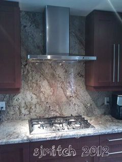 Has anyone done a full granite backsplash behind range?