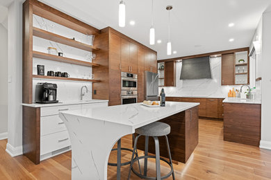 Large minimalist u-shaped brown floor and light wood floor eat-in kitchen photo in Ottawa with an undermount sink, flat-panel cabinets, white backsplash, stainless steel appliances, an island, white countertops, medium tone wood cabinets, quartz countertops and quartz backsplash