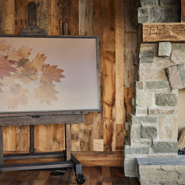 Hand Hewn Timber Mantel and Weathered Antique Paneling in Farmhouse Living Room