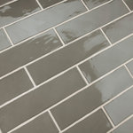Merola Tile - Chester Grey Ceramic Wall Tile - Offering a subway look, our Chester Grey Ceramic Wall Tile features a smooth, glossy finish, providing decorative appeal that adapts to a variety of stylistic contexts. With its semi-vitreous features, this gray rectangle tile is an ideal selection for indoor commercial and residential installations, including kitchens, bathrooms, backsplashes, showers, hallways and fireplace facades. This tile is a perfect choice on its own or paired with other products in the Chester Collection. Tile is the better choice for your space!