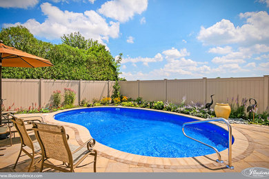 Trendy backyard pool photo in New York