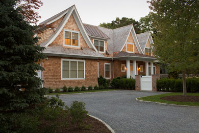 Example of a mid-sized transitional brown two-story wood gable roof design in New York