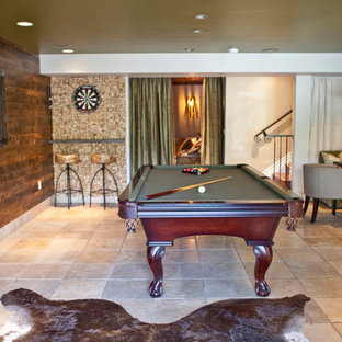 Inspiration for a large rustic basement in San Diego with beige walls, limestone flooring, no fireplace and brown floors.