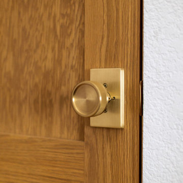 Brass hardware, wood panel door — 90s Fixer, Reno interior design by Find Design