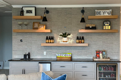 Inspiration for a transitional home bar remodel in Nashville