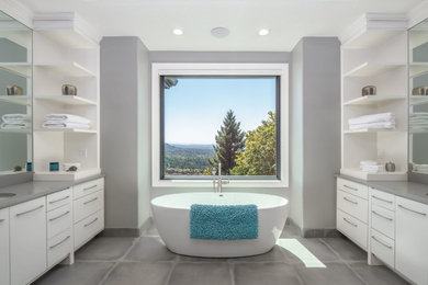 Bathroom - large modern master gray floor, double-sink and tray ceiling bathroom idea in Portland with flat-panel cabinets, white cabinets, gray walls, an undermount sink, gray countertops and a built-in vanity