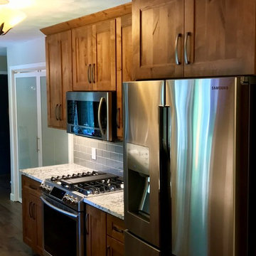 Dura Supreme Cabinets Knotty Alder Butternut Romanix Granite Galley Kitchen