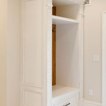 Traditional white entry mudroom.
