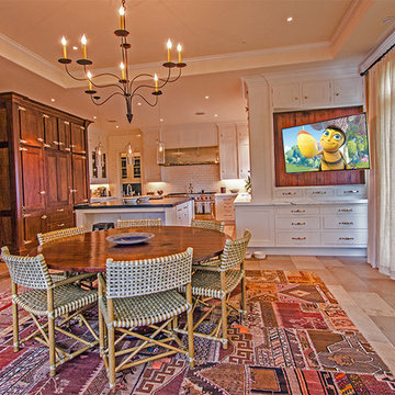 Kitchen with TV on motorized articulating arm