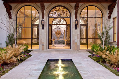 Mid-sized elegant courtyard tile patio photo in Dallas