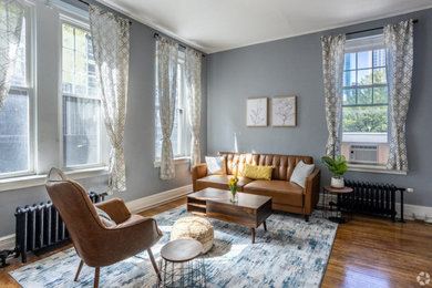 Small urban open concept dark wood floor living room photo in Charlotte with gray walls