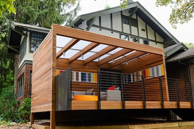 Inspiration for a mid-sized contemporary white one-story wood exterior home remodel in Other