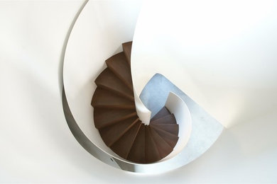 Staircase - large modern wooden spiral staircase idea in Other with wooden risers