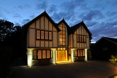 Inspiration for a large and beige contemporary two floor detached house in London with a tiled roof.