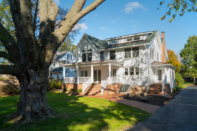 Inspiration for a mid-sized timeless white two-story wood exterior home remodel in Philadelphia with a shingle roof
