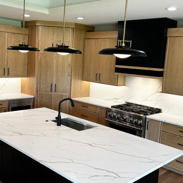 Maple Pecan Stain and Painted Black Kitchen Design in Bettendorf, Iowa