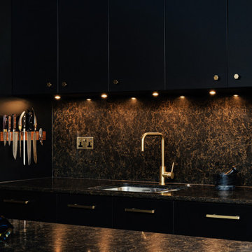 Black kitchen with Brass details