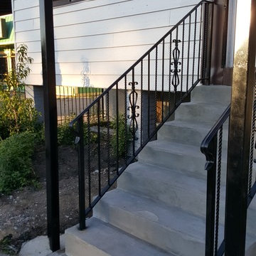 AFTER PHOTO Front Porch wood to concrete with wrought iron hand rails