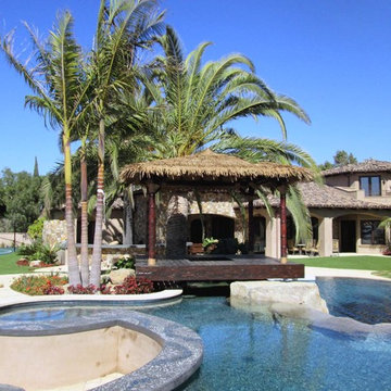 12'x12' Maldives inspired Hut in Synthetic thatch - carved poles in teak stain